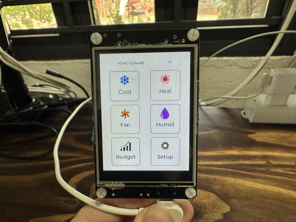 Handheld HVAC controller running an on-device touch UI